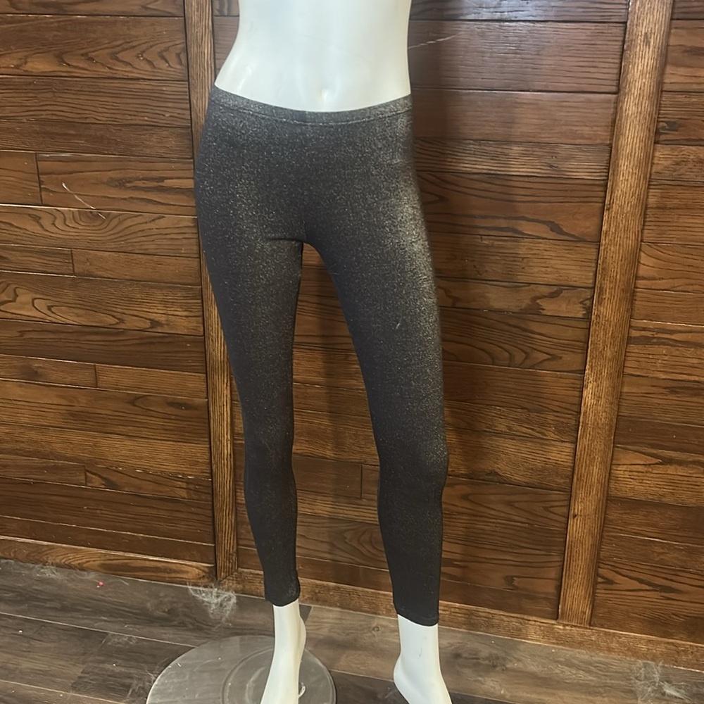 Arianne. Gold and black. Shimmery leggings. Size medium.